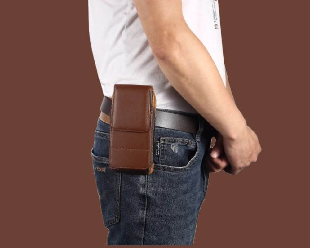 A durable brown leather phone pouch securely attached to a belt, offering a hands-free